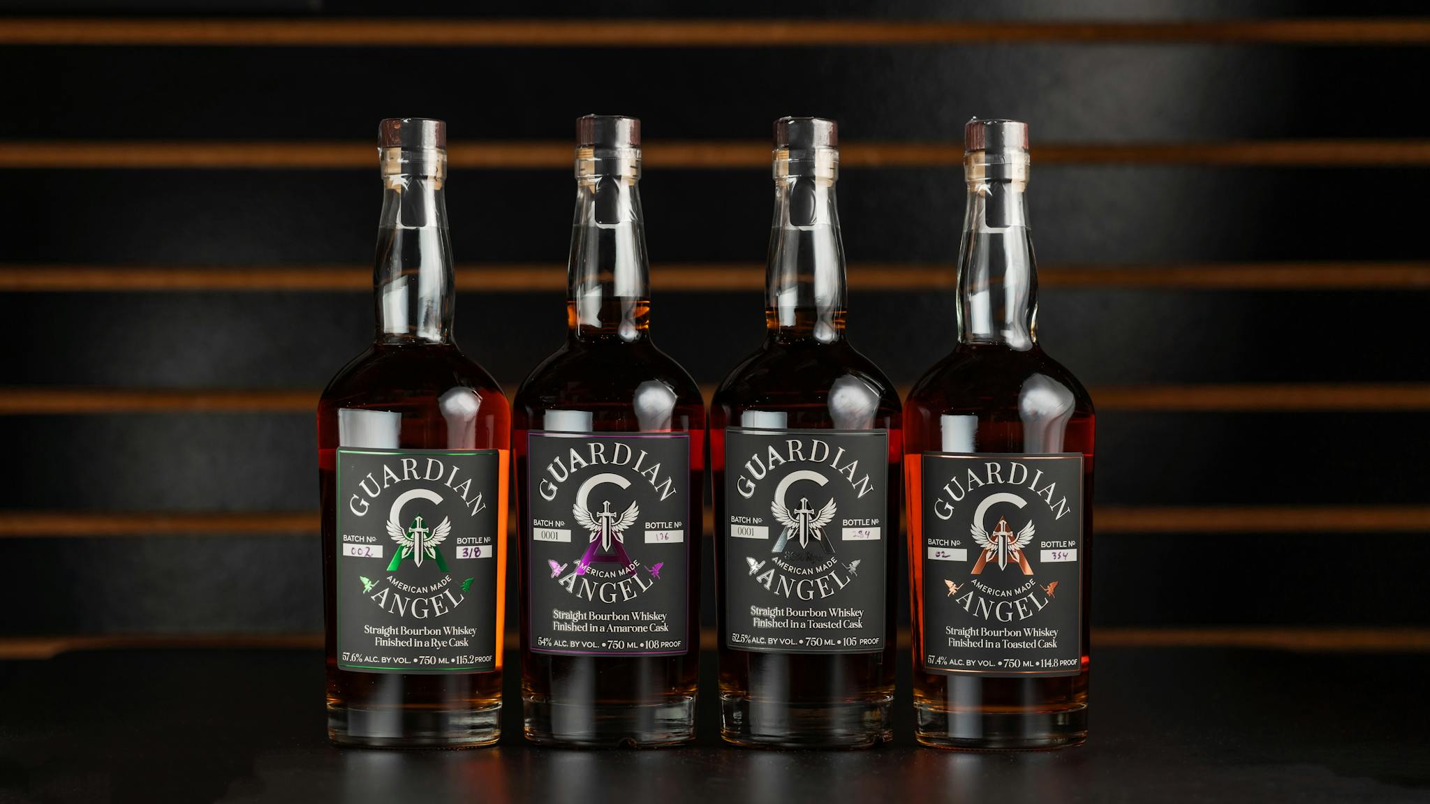 A lineup of Guardian Angel bourbon bottles displayed stylishly in a New Orleans bar.